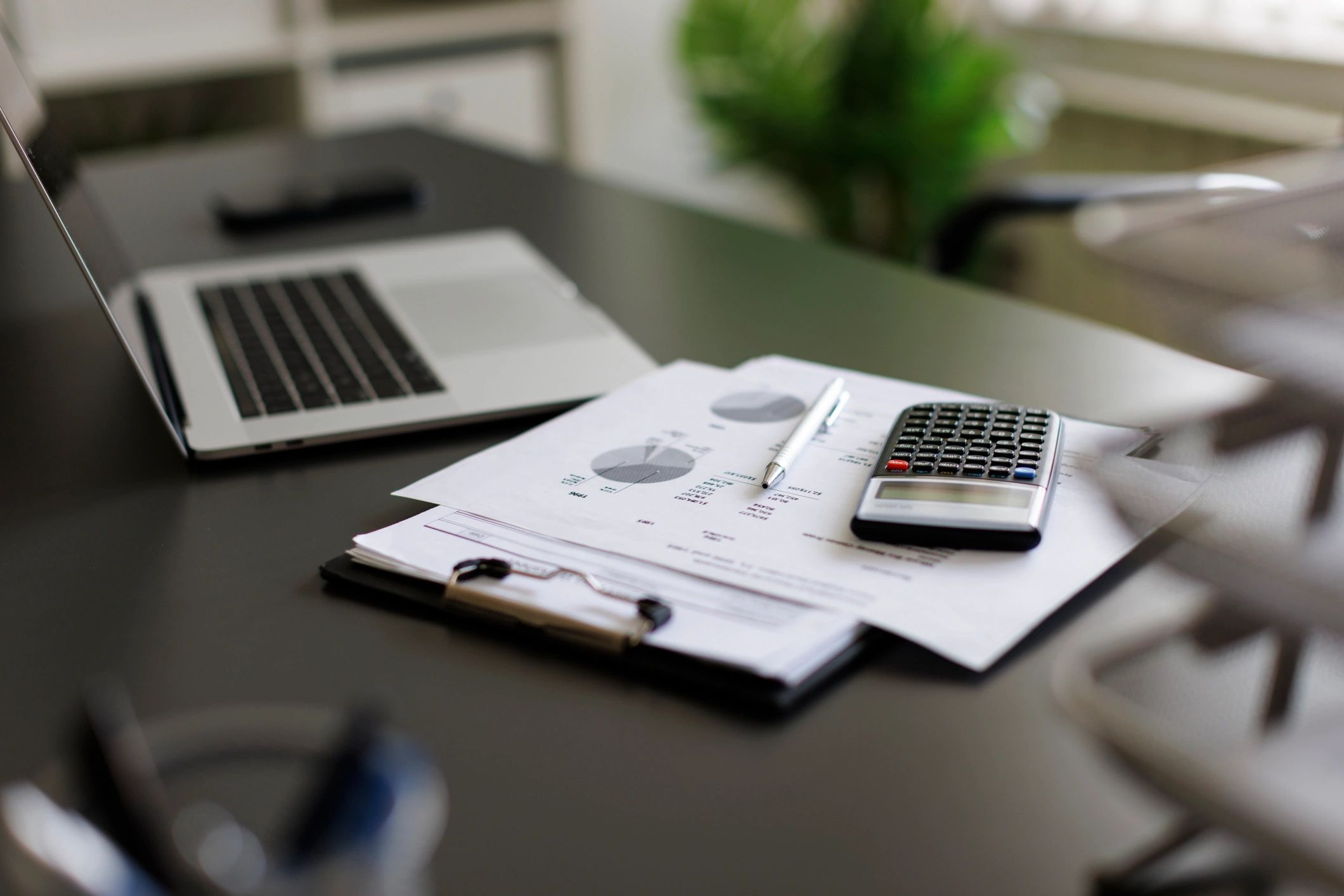 Desk with real estate documents and analysis materials